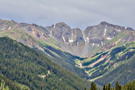 A view from the road of a distant valley and ridge above it