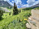 Trail/Road on the right with a valley and peaks to the left and in the distance