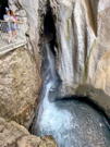 Metal overlook viewing a falls coming out of a box canyon