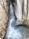 Waterfall plunging out of a box canyon