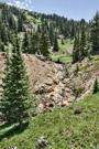 A stream tumbing down over a rocky surface
