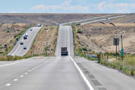 Two lane highway across rolling landscape