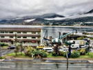 Building and dock with channel and mountains in the background