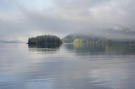 Sun peaking through the clouds and an island as we arrive in Windham Bay
