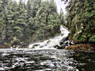 My paddle board friend examining ways to get near the base of the cascade
