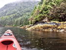 Done with the cascade, rowing along the shore as it starts to rain