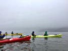 One of our kayaking guides (only ones with one man kayaks) gets us ready to start into the fog over the water