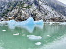 The deep blue of the large iceberg shows it is very dense and had come from deep within the glacier