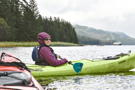 One of our kayaking group with our ship in the background