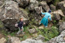 Looking down at hikers scrambling along the trail