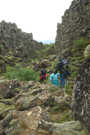The trail continues to wind through the stone and brush
