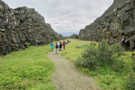 Hikers going along the trail as it nears the end of the rift