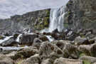 A waterfall dropping over the basalt ledge