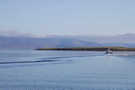 Engey Lighthouse on Engey island looking back at volcanic mountains