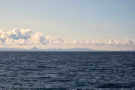 Off the coast near Reykjavik with volcanic peaks in the distnace