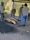 Covering the food and stones of the Pachamanca to keep the heat in