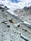 Looking down the other side of the glacial lateral moraine at the glacier (greatly reduced in size)