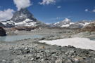 The trail approaches a small lake under the Matterhorn