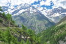Looking across the valley at the massive mountains as the trail drops around a corner
